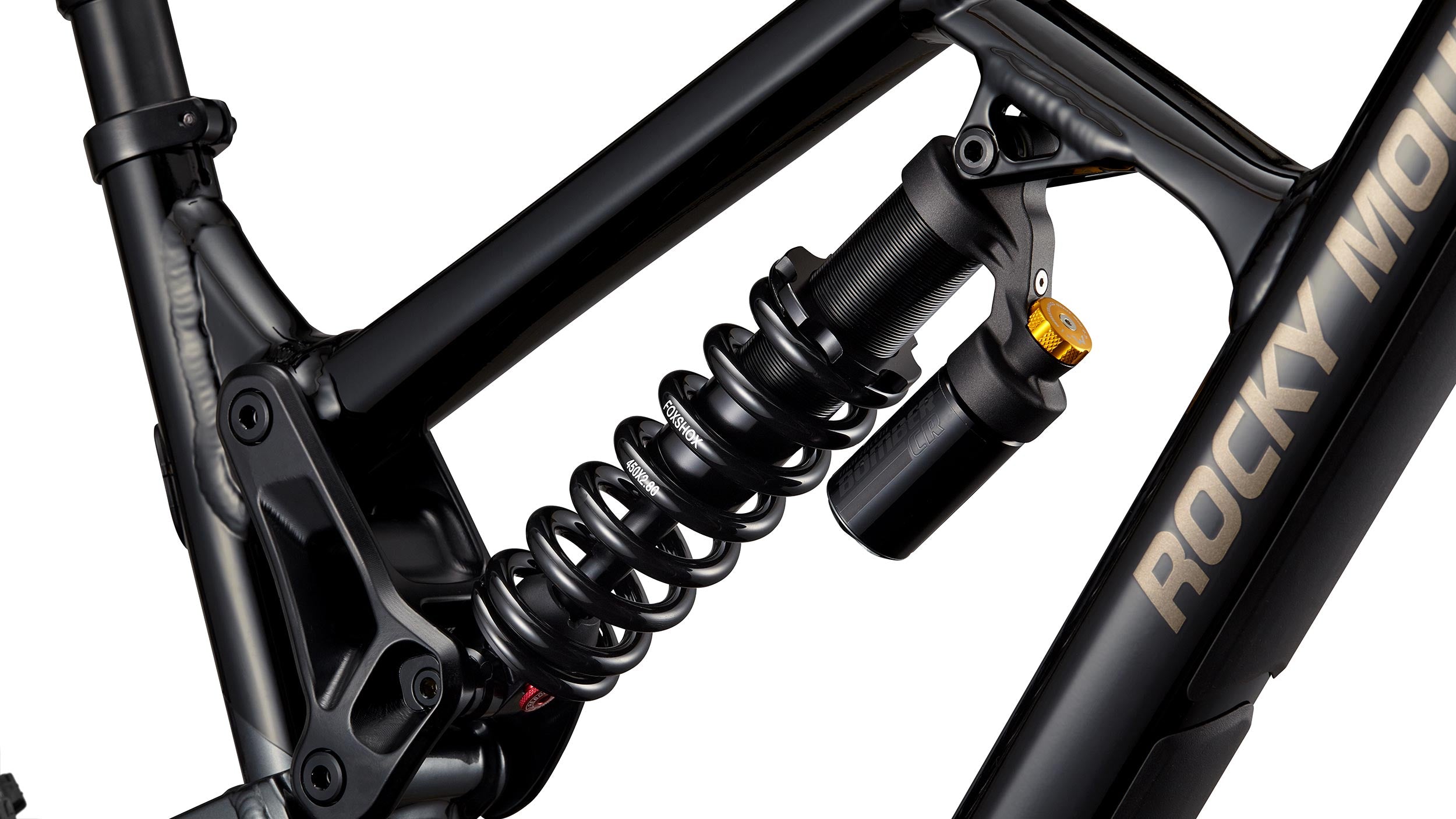 _caption_The Marzocchi Bomber CR is a durable and easy to adjust shock known for its reliability. It provides a smooth and responsive ride, making it suitable for various trail conditions.